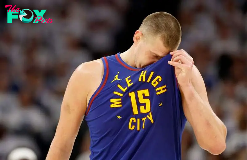 Nikola Jokic #15 of the Denver Nuggets reacts 