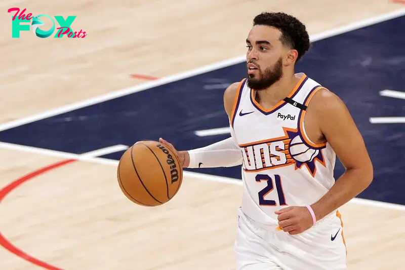 Phoenix Suns guard Tyus Jones dribbles the ball 