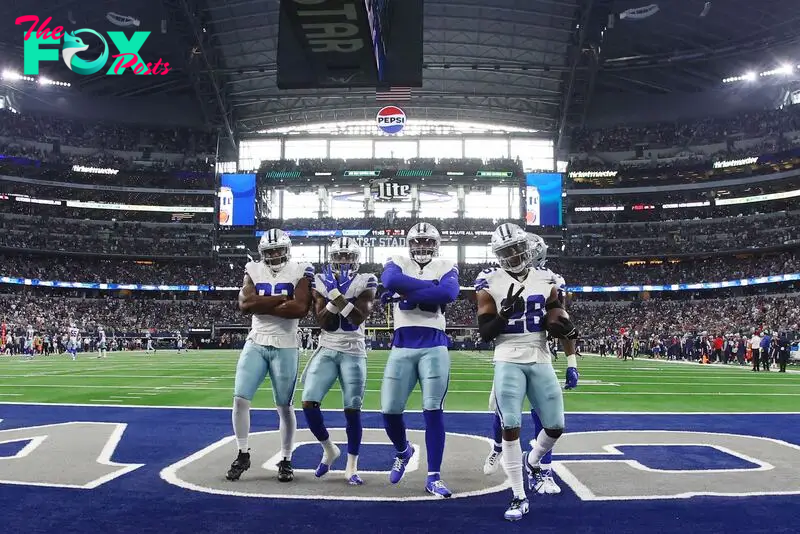 ARLINGTON, TEXAS - OCTOBER 01: Dallas Cowboys players celebrate with DaRon Bland #26 of the Dallas Cowboys after his interception during the third quarter against the New England Patriots at AT&T Stadium on October 01, 2023 in Arlington, Texas.   Richard Rodriguez/Getty Images/AFP (Photo by Richard Rodriguez / GETTY IMAGES NORTH AMERICA / Getty Images via AFP)