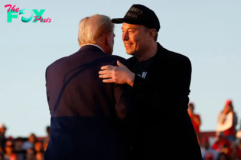 Elon Musk embraces Trump during a campaign rally in Butler, Pa. on Oct. 5.