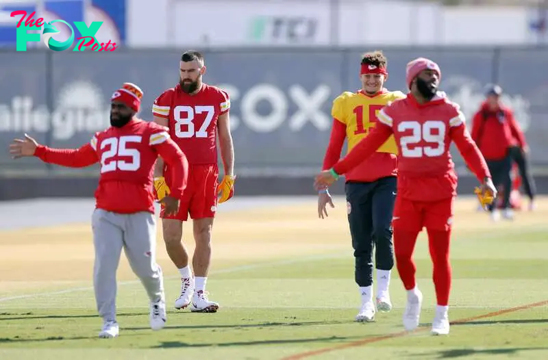 Quarterback Patrick Mahomes #15 and tight end Travis Kelce #87 warm-up during Kansas City Chiefs practice.