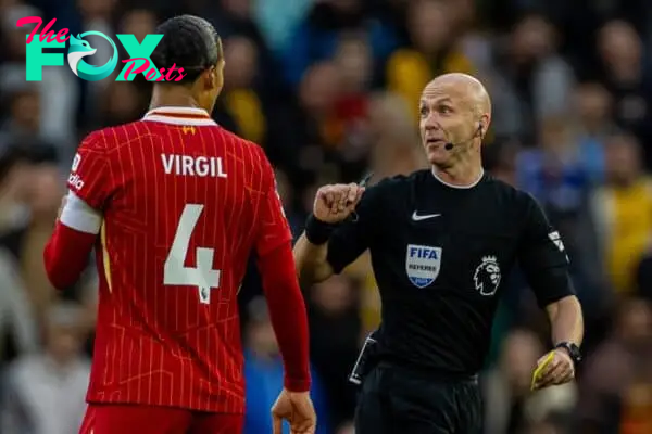 WOLVERHAMPTON, ENGLAND - Saturday, September 28, 2024: Referee Anthony Taylor (R) and Liverpool's captain Virgil van Dijk during the FA Premier League match between Wolverhampton Wanderers FC and Liverpool FC at Molineux Stadium. (Photo by David Rawcliffe/Propaganda)