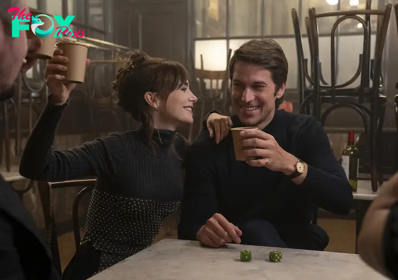  Lily Collins, left, and Lucas Bravo in a scene from "Emily in Paris."