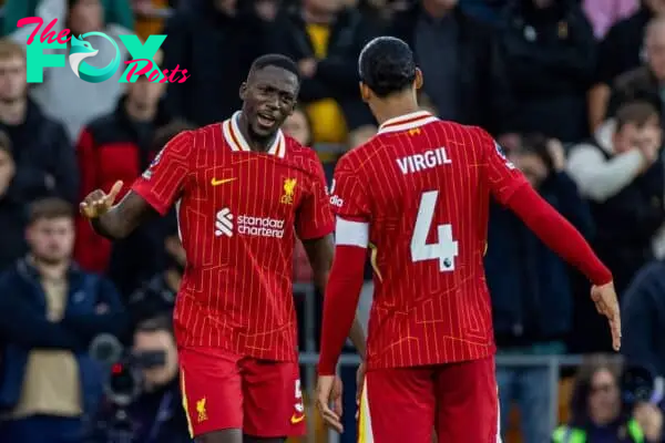 WOLVERHAMPTON, ENGLAND - Saturday, September 28, 2024: Liverpool's Ibrahima Konaté (L) celebrates with team-mate captain Virgil van Dijk after scoring the opening goal during the FA Premier League match between Wolverhampton Wanderers FC and Liverpool FC at Molineux Stadium. (Photo by David Rawcliffe/Propaganda)