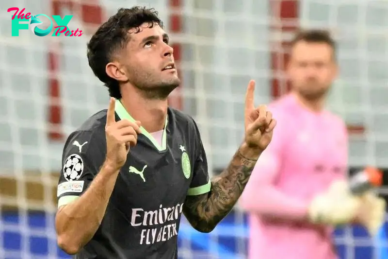 Christian Pulisic celebrates scoring the 1-0 goal during the UEFA Champions League soccer match between AC Milan and Club Brugge