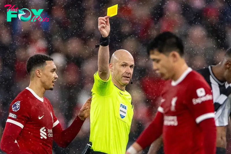 LIVERPOOL, ENGLAND - Monday, January 1, 2024: Liverpool's Wataru Endo is shown a yellow card by referee Anthony Taylor during the FA Premier League match between Liverpool FC and Newcastle United FC on New Year's Day at Anfield. Liverpool won 4-2. (Photo by David Rawcliffe/Propaganda)