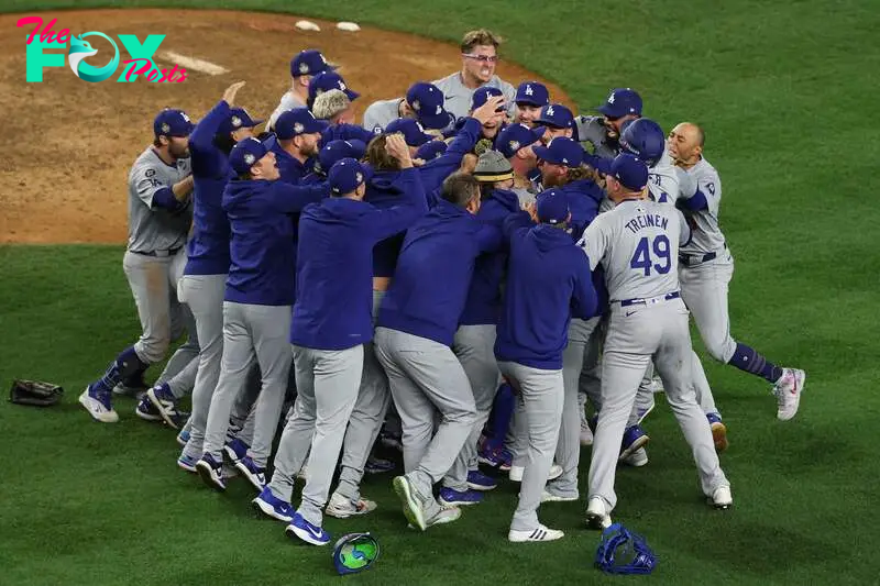 NEW YORK, NEW YORK - OCTOBER 30: The Los Angeles Dodgers celebrate as the they defeat the New York Yankees 7-6 in game 5 to win the 2024 World Series at Yankee Stadium on October 30, 2024 in the Bronx borough of New York City.   Al Bello/Getty Images/AFP (Photo by AL BELLO / GETTY IMAGES NORTH AMERICA / Getty Images via AFP)