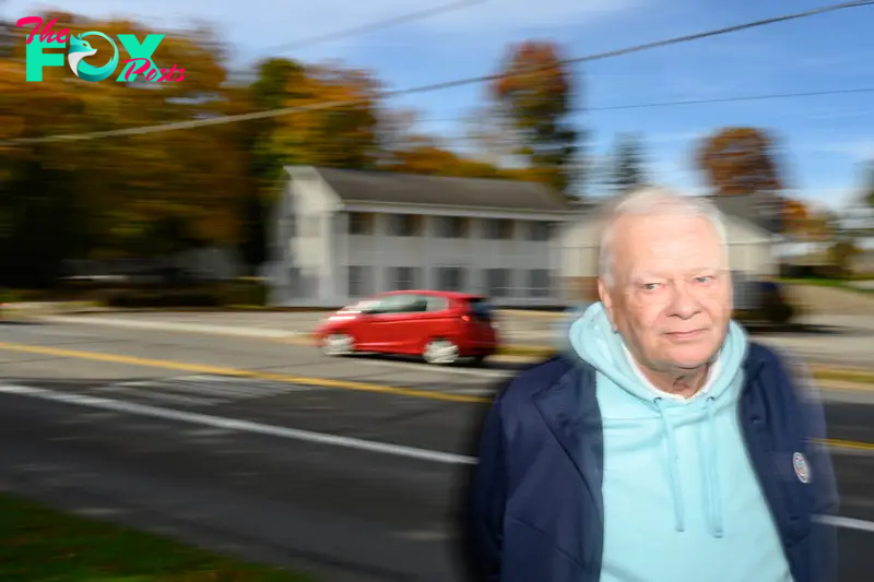 Clyde Tree stands along Cleveland Road in Wooster, OH, where he watched pickup trucks with Trump flags parade through town after the 2016 election.