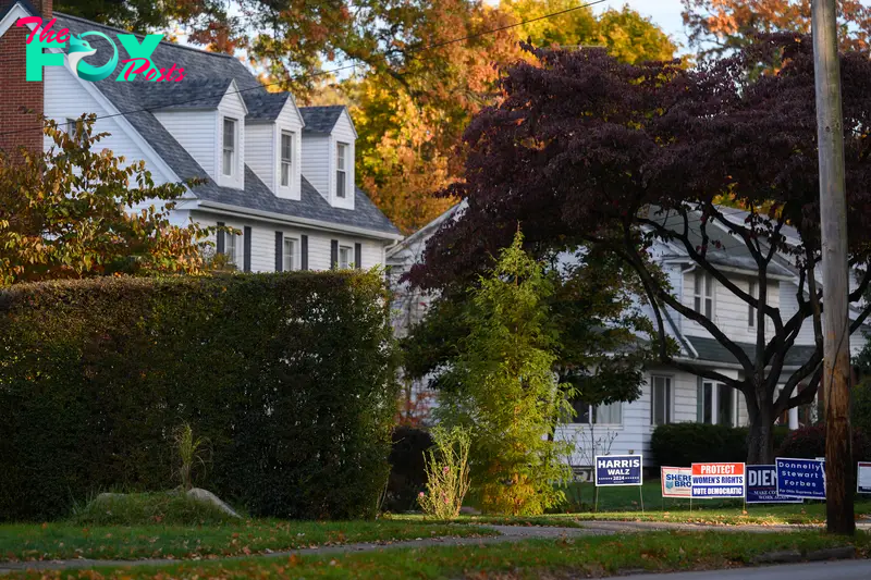 A Harris-Walz sign in a yard across from The College of Wooster.