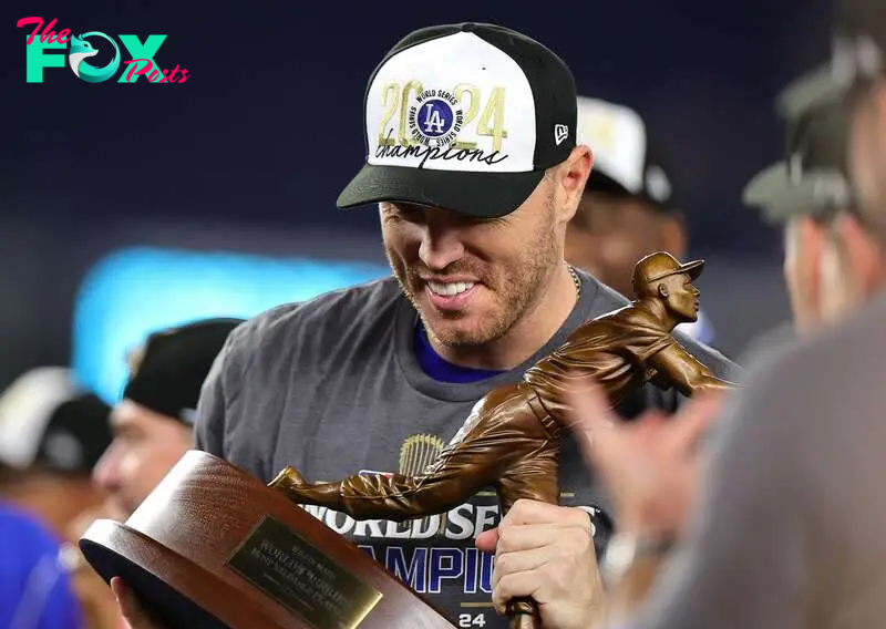 NEW YORK, NEW YORK - OCTOBER 30: Freddie Freeman #5 of the Los Angeles Dodgers is presented with the MVP trophy after the Dodgers defeated the New York Yankees 7-6 in game 5 to win the 2024 World Series at Yankee Stadium on October 30, 2024 in the Bronx borough of New York City.   Alex Slitz/Getty Images/AFP (Photo by Alex Slitz / GETTY IMAGES NORTH AMERICA / Getty Images via AFP)