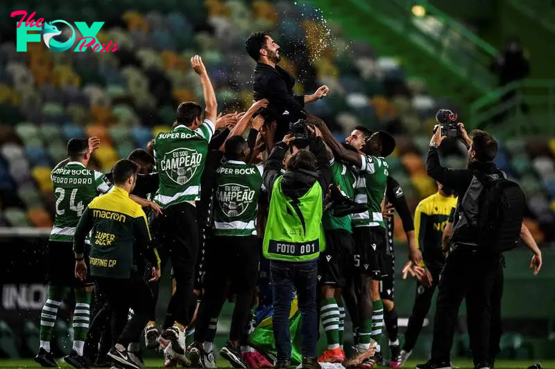 (FILES) Players toss Sporting's head coach Ruben Amorim