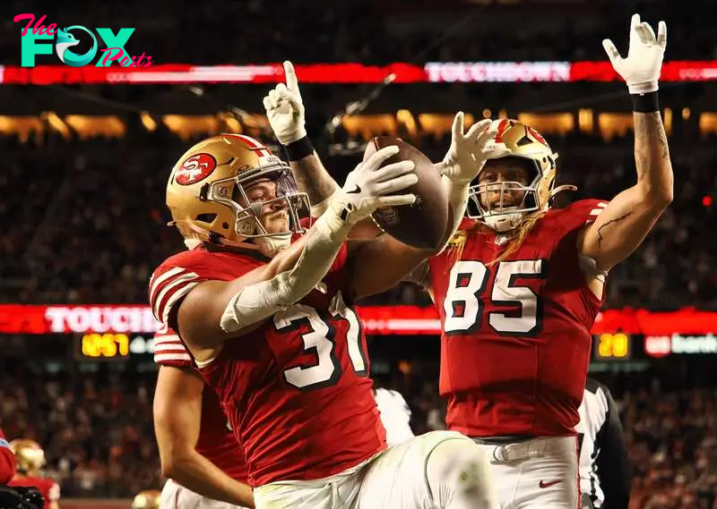 Oct 27, 2024; Santa Clara, California, USA; San Francisco 49ers running back Isaac Guerendo (31) celebrates with San Francisco 49ers tight end George Kittle (85) after scoring a touchdown against the Dallas Cowboys during the third quarter at Levi's Stadium. Mandatory Credit: Kelley L Cox-Imagn Images