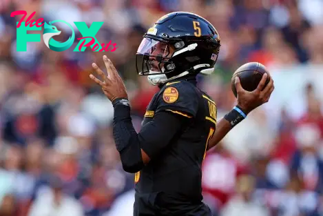 Oct 27, 2024; Landover, Maryland, USA; Washington Commanders quarterback Jayden Daniels (5) throws a pass during the first quarter against the Chicago Bears at Commanders Field. Mandatory Credit: Peter Casey-Imagn Images