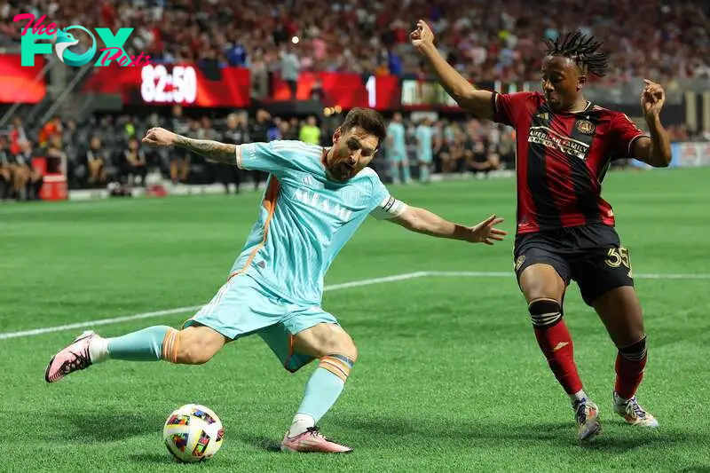 Lionel Messi #10 of Inter Miami attempts to cross the ball against Ajani Fortune #35 of Atlanta United 