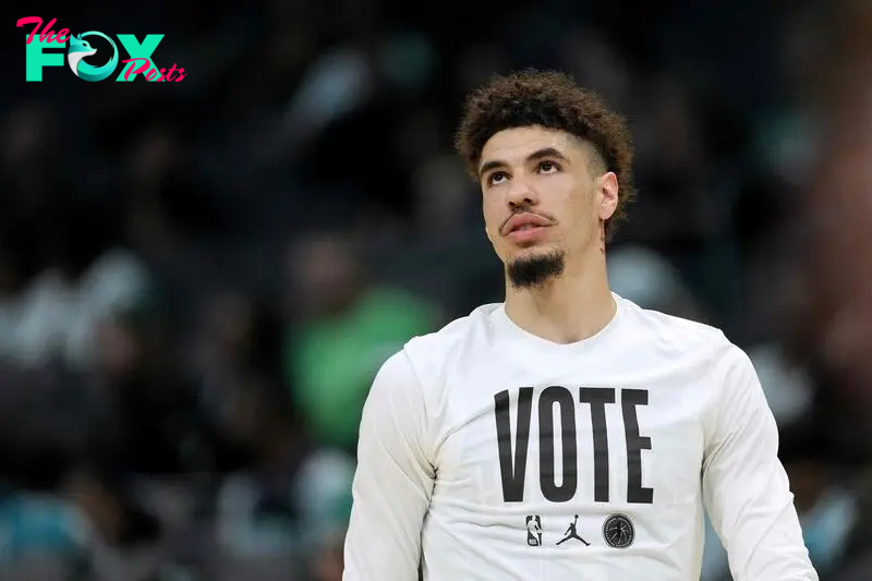 LaMelo Ball #1 of the Charlotte Hornets wears a "Vote" shirt as he warms up before the game against the Boston Celtics.