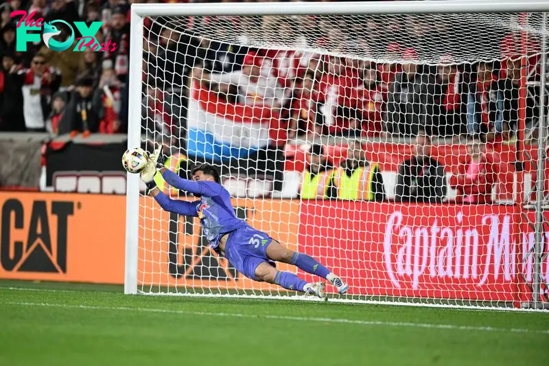 New York Red Bulls goalkeeper Carlos Coronel (31) saves a penalty kick against the Columbus Crew in a 2024 MLS Cup Playoffs 