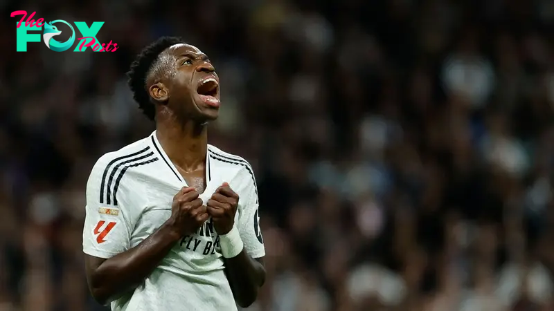 TOPSHOT - Real Madrid's Brazilian forward #07 Vinicius Junior reacts during the Spanish league football match between Real Madrid CF and FC Barcelona at the Santiago Bernabeu stadium in Madrid on October 26, 2024. (Photo by OSCAR DEL POZO / AFP)