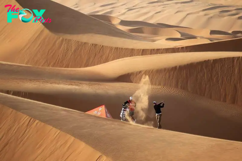 ABU DHABI, UNITED ARAB EMIRATES - JANUARY 24:  Martin Kaymer of Germany the defending champion of the HSBC Abu Dhabi Championship plays from amongst the 250ft high sand dunes in Abu Dhabi's Liwa Desert at the entrance to Rub Al Khali (The Empty Quarter) as a preview for the 2012 Abu Dhabi HSBC Golf Championship at the Abu Dhabi Golf Club on January 24, 2012 in Abu Dhabi, United Arab Emirates.  (Photo by David Cannon/Getty Images)