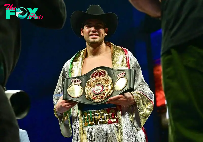 Mexico's Gilberto "Zurdo" Ramirez holds the title belt after winning the fight against France's Arsen Goulamirian for the WBA cruiserweight title bout at the YouTube Theatre in Inglewood, California, March 30, 2024. Goulamirian is defending his 200-pound title for the fifth time against Ramirez. (Photo by Frederic J. Brown / AFP)