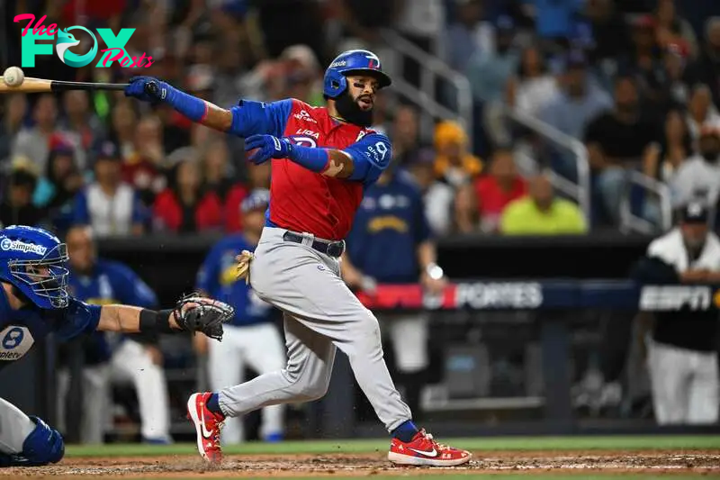 Dominican Republic's outfielder #01 Emilio Bonifacio swings his bat during the Caribbean Series baseball championship game between the Dominican Republic and Venezuela at LoanDepot Park in Miami, Florida, on February 9, 2024. (Photo by Chandan Khanna / AFP)