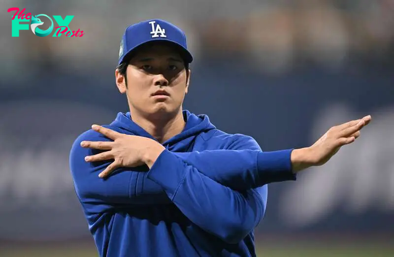 (FILES) Los Angeles Dodgers' Shohei Ohtani warms up during practice at the Gocheok Sky Dome in Seoul on March 20, 2024, ahead of the 2024 MLB Seoul Series baseball game between Los Angeles Dodgers and San Diego Padres. Japanese superstar Shohei Ohtani had surgery on November 5 to repair his left shoulder after it was partially dislocated in game two of the club's World Series triumph over the New York Yankees, the Dodgers said.
The Major League Baseball team said in a statement that Ohtani had "successful arthroscopic surgery" in Los Angeles to repair a labrum tear that resulted from the dislocation. (Photo by Jung Yeon-je / AFP)