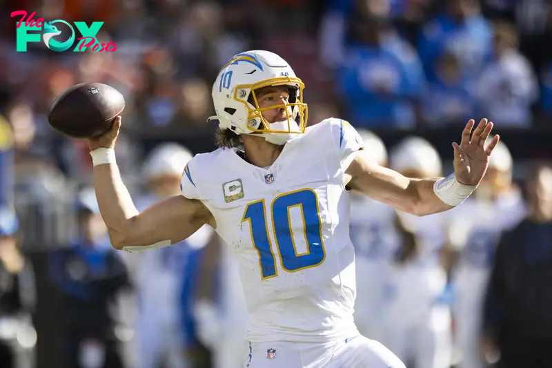 Nov 3, 2024; Cleveland, Ohio, USA; Los Angeles Chargers quarterback Justin Herbert (10) throws the ball against the Cleveland Browns during the second quarter at Huntington Bank Field. Mandatory Credit: Scott Galvin-Imagn Images