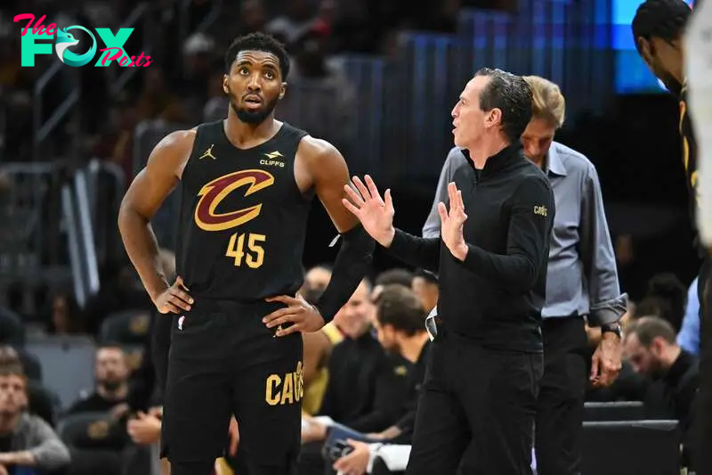 Donovan Mitchell #45 talks to head coach Kenny Atkinson