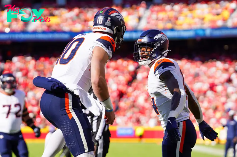 Nov 10, 2024; Kansas City, Missouri, USA; Denver Broncos wide receiver Courtland Sutton (14) celebrates with quarterback Bo Nix (10) after scoring against the Kansas City Chiefs during the first half at GEHA Field at Arrowhead Stadium. Mandatory Credit: Denny Medley-Imagn Images