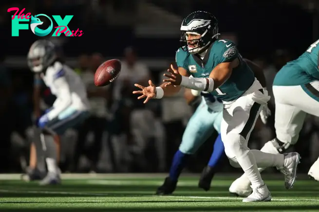 Nov 10, 2024; Arlington, Texas, USA; Philadelphia Eagles quarterback Jalen Hurts (1) pitches the ball in the second quarter against the Dallas Cowboys at AT&T Stadium. Mandatory Credit: Tim Heitman-Imagn Images