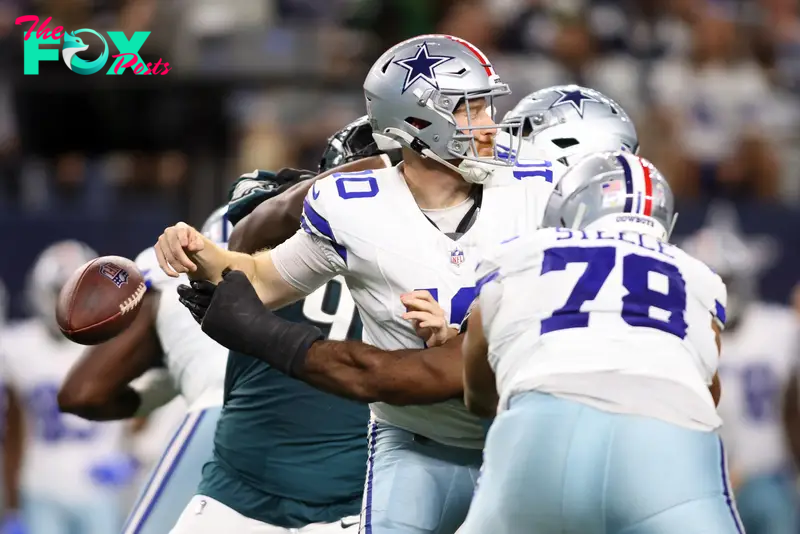 Nov 10, 2024; Arlington, Texas, USA; Dallas Cowboys quarterback Cooper Rush (10) fumbles the ball against the Philadelphia Eagles in the third quarter at AT&T Stadium. Mandatory Credit: Tim Heitman-Imagn Images