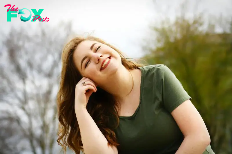 A happy woman smiling while enjoying the sun | Source: Pexels