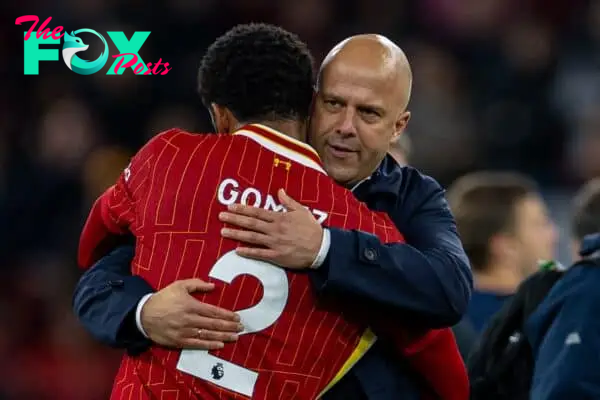 LIVERPOOL, ENGLAND - Saturday, November 2, 2024: Liverpool's Joe Gomez (L) embraces head coach Arne Slot after the FA Premier League match between Liverpool FC and Brighton & Hove Albion FC at Anfield. (Photo by David Rawcliffe/Propaganda)