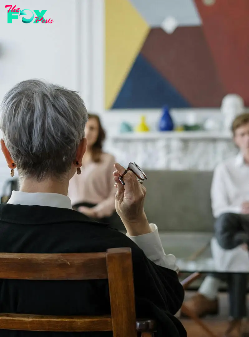 An older woman talking to a young couple | Source: Pexels