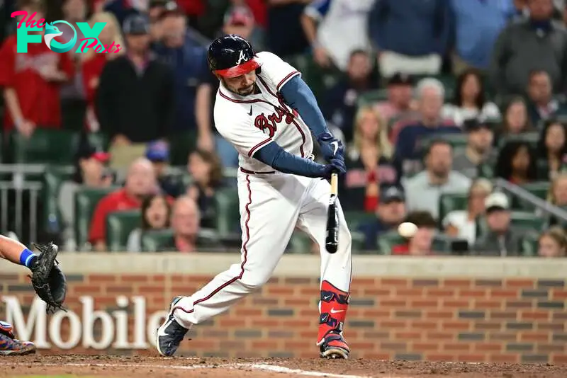 ATLANTA, GA - OCTOBER 2: Travis d'Arnaud #16 of the Atlanta Braves hits a two-run RBI against the New York Mets during the third inning at Truist Park on October 2, 2022 in Atlanta, Georgia.   Adam Hagy/Getty Images/AFP