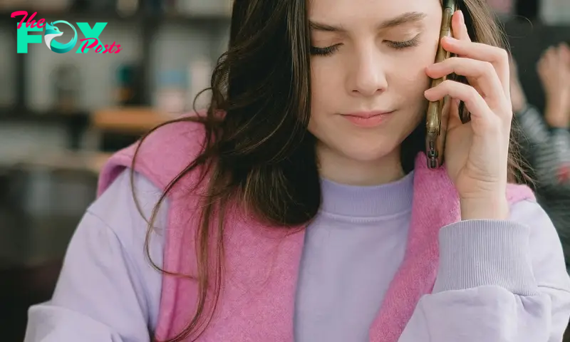 Elly calling a babysitter while trying to mask her growing suspicions | Source: Pexels