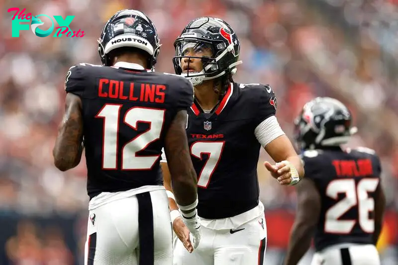 HOUSTON, TEXAS - SEPTEMBER 29: C.J. Stroud #7 and Nico Collins #12 of the Houston Texans high five during the second quarter of the game against the Jacksonville Jaguars at NRG Stadium on September 29, 2024 in Houston, Texas.   Tim Warner/Getty Images/AFP (Photo by Tim Warner / GETTY IMAGES NORTH AMERICA / Getty Images via AFP)