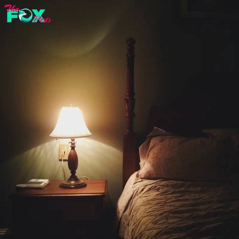 A nightlight next to a bed | Source: Midjourney