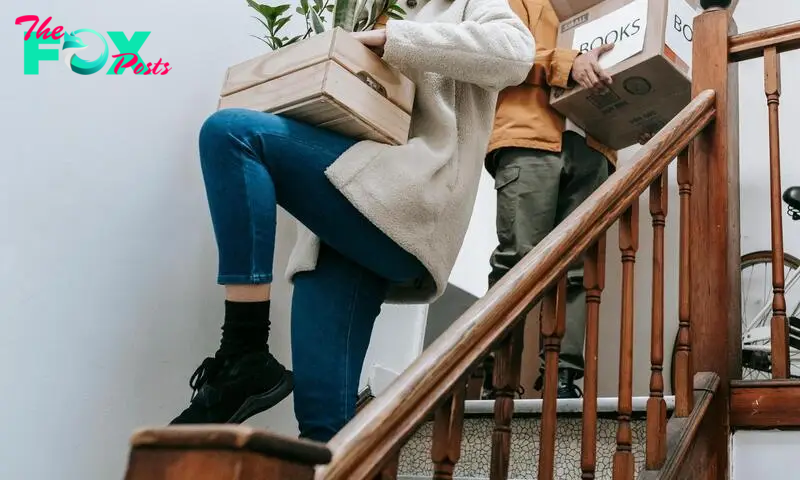 Packed items being carried down stairs | Source: Pexels