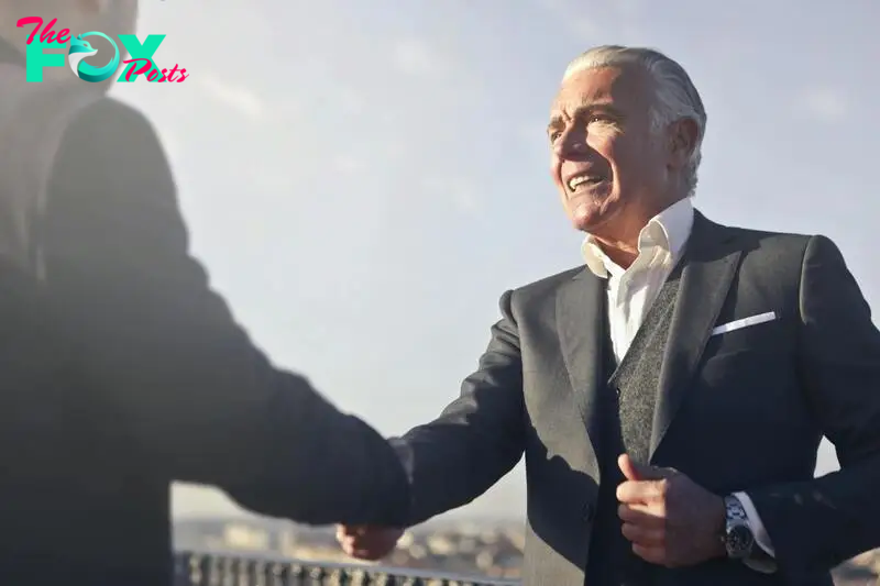 Two men shake hands in introduction  | Source: Pexels