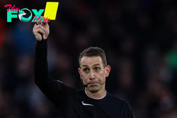 MANCHESTER, ENGLAND - Saturday, December 30, 2023: Referee David Coote shows a yellow card during the FA Premier League match between Manchester City FC and Sheffield United FC at the City of Manchester Stadium. Man City won 2-0. (Photo by David Rawcliffe/Propaganda)