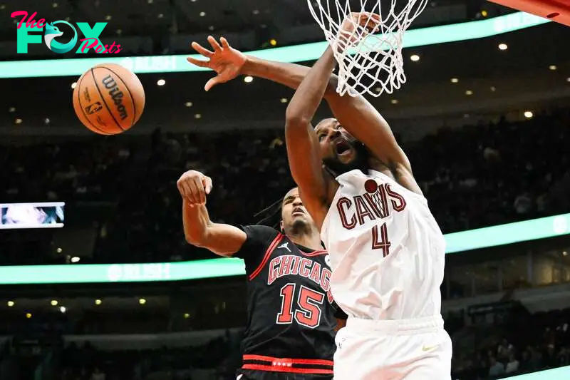 Nov 11, 2024; Chicago, Illinois, USA;  Chicago Bulls forward Julian Phillips (15) blocks a shot by Cleveland Cavaliers forward Evan Mobley (4) during the first half at United Center. Mandatory Credit: Matt Marton-Imagn Images