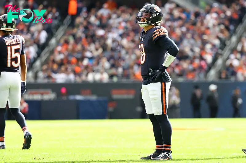 Nov 10, 2024; Chicago, Illinois, USA; Chicago Bears quarterback Caleb Williams (18) reacts against the New England Patriots during the first quarter at Soldier Field. Mandatory Credit: Mike Dinovo-Imagn Images