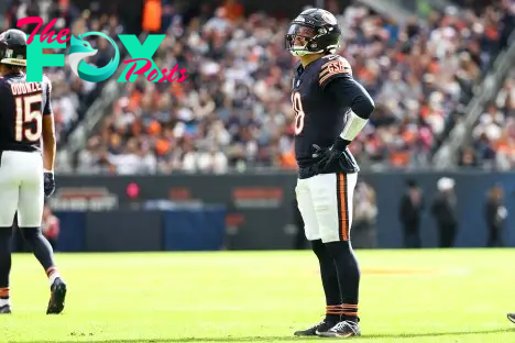 Nov 10, 2024; Chicago, Illinois, USA; Chicago Bears quarterback Caleb Williams (18) reacts against the New England Patriots during the first quarter at Soldier Field. Mandatory Credit: Mike Dinovo-Imagn Images