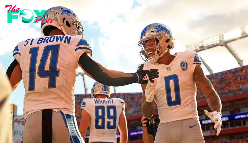 Marvin Jones Jr. #0 and Amon-Ra St. Brown #14 of the Detroit Lions.