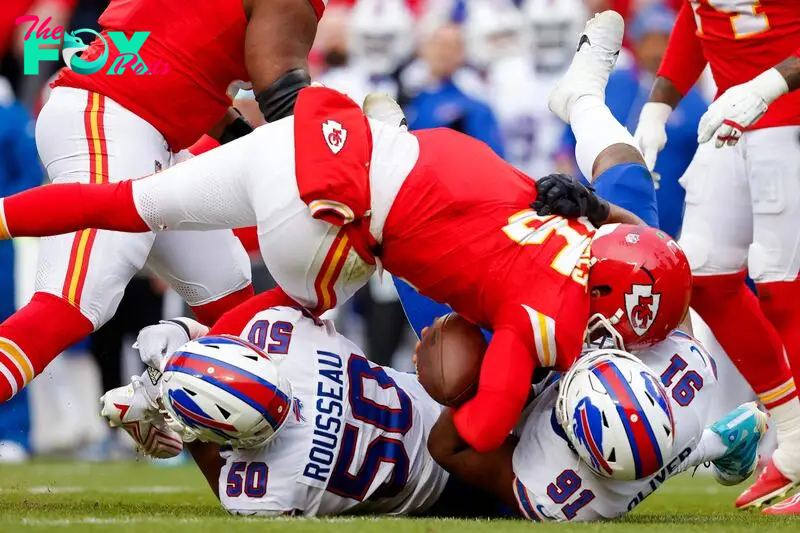 Patrick Mahomes #15 of the Kansas City Chiefs is sacked by Ed Oliver #91 of the Buffalo Bills.