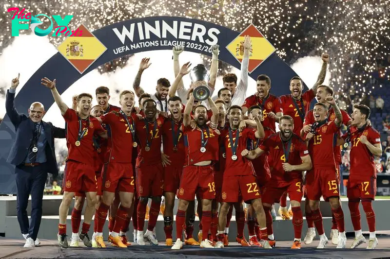 Jordi Alba of Spain lifts the Nations League trophy