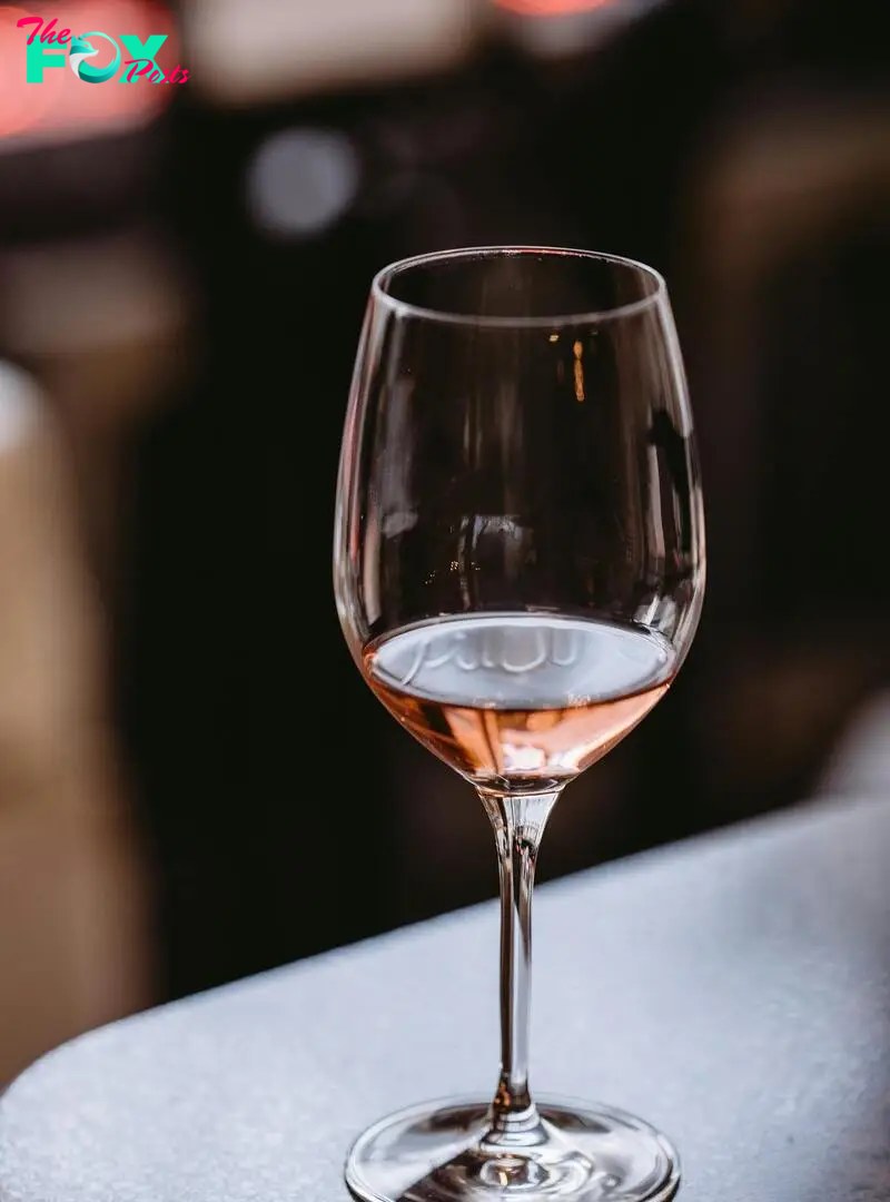 A glass of wine on a table | Source: Pexels