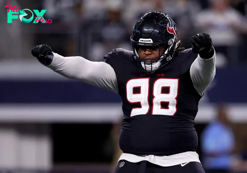 Tim Settle Jr. of the Houston Texans celebrates after sacking Cooper Rush of the Dallas Cowboys during the fourth quarter.