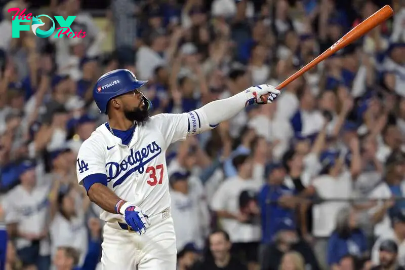 Oct 11, 2024; Los Angeles, California, USA; Los Angeles Dodgers outfielder Teoscar Hernandez (37) hits a solo home run in the seventh inning against the San Diego Padres during game five of the NLDS for the 2024 MLB Playoffs at Dodger Stadium. Mandatory Credit: Jayne Kamin-Oncea-Imagn Images