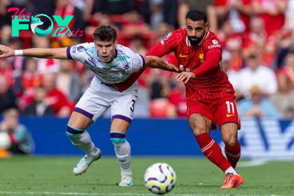 LIVERPOOL, ENGLAND - Saturday, September 21, 2024: Liverpool's Mohamed Salah (R) is challenged by AFC Bournemouth's Milos Kerkez during the FA Premier League match between Liverpool FC and AFC Bournemouth at Anfield. Liverpool won 3-0. (Photo by David Rawcliffe/Propaganda)